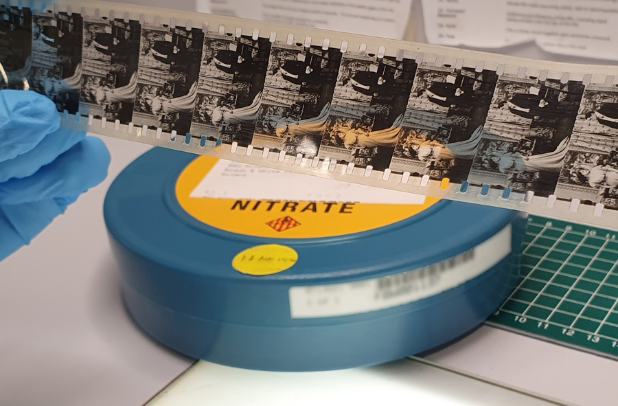 Strip of nitrate film and film can.