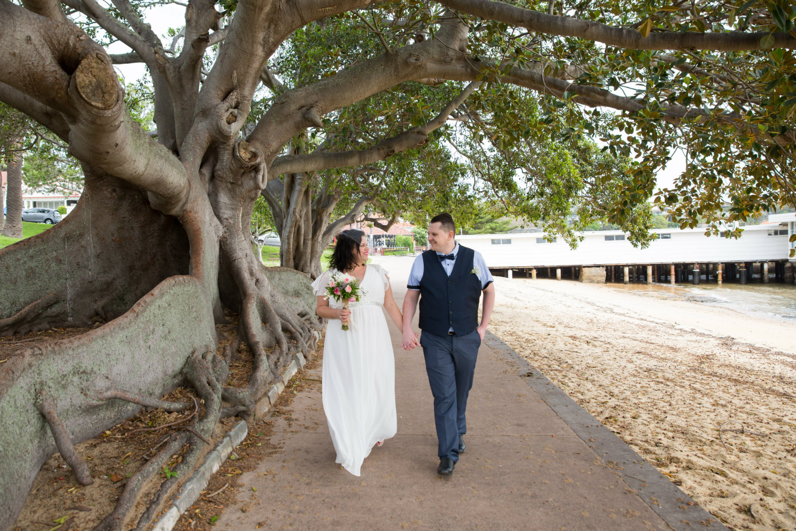 Tasha James and husband Chris on their wedding day beneath a tree