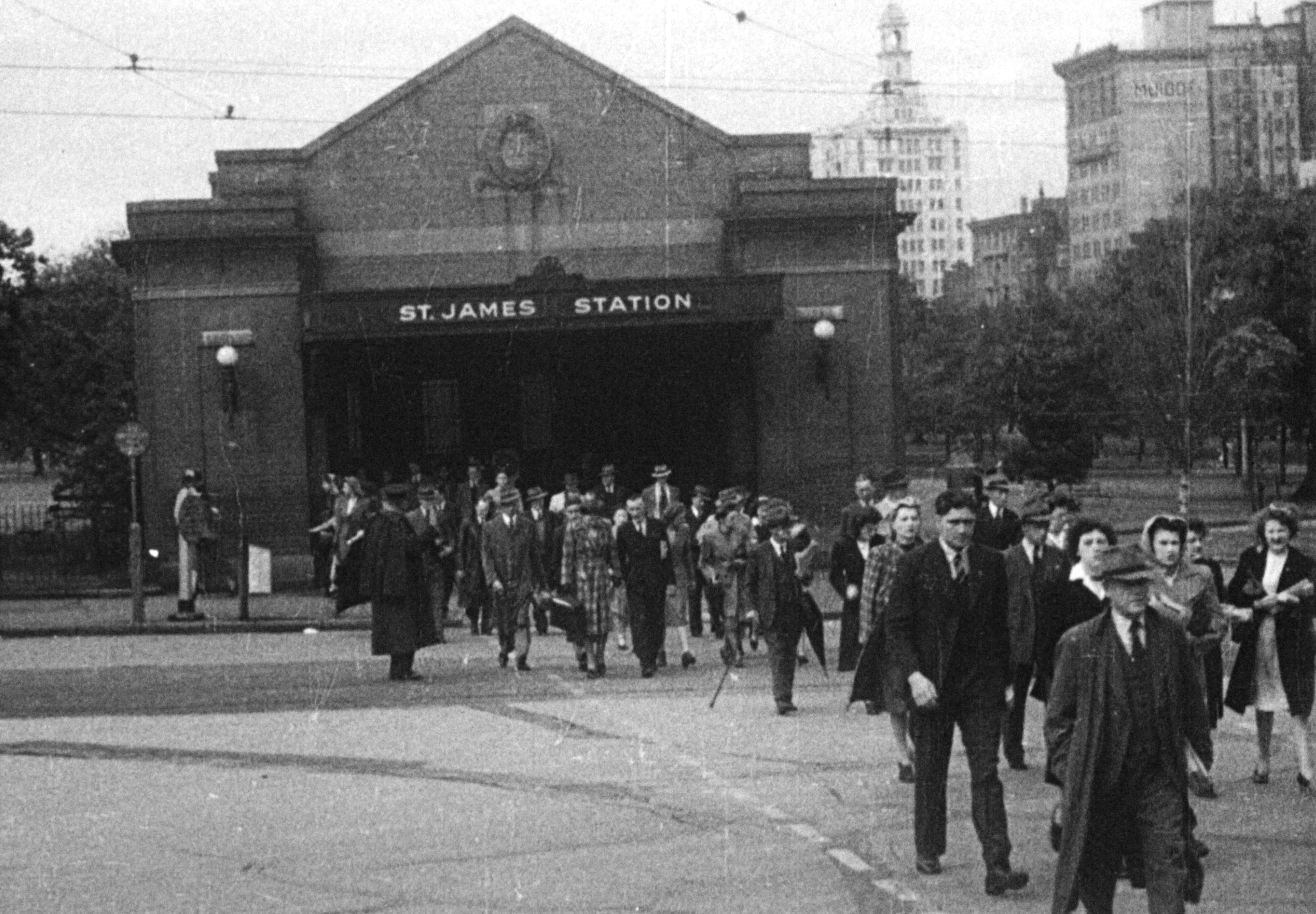 Black and white still of the front of St James Station in Sydney from the street.