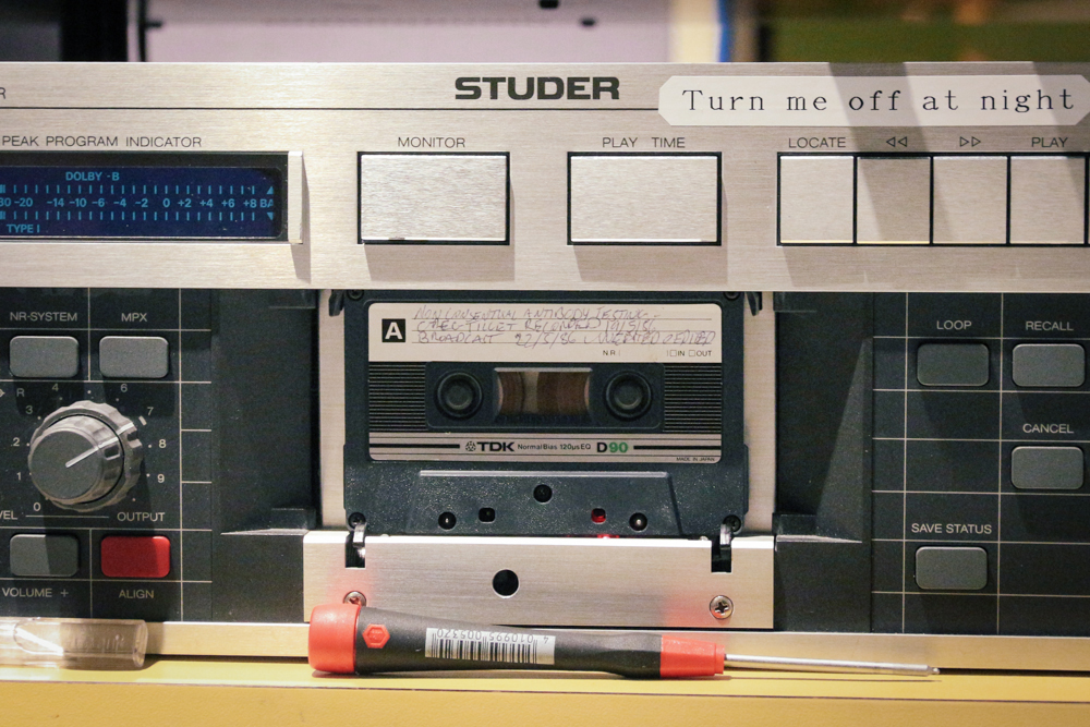 Close up of digital tape recording equipment digitising a gaywaves cassette tape.