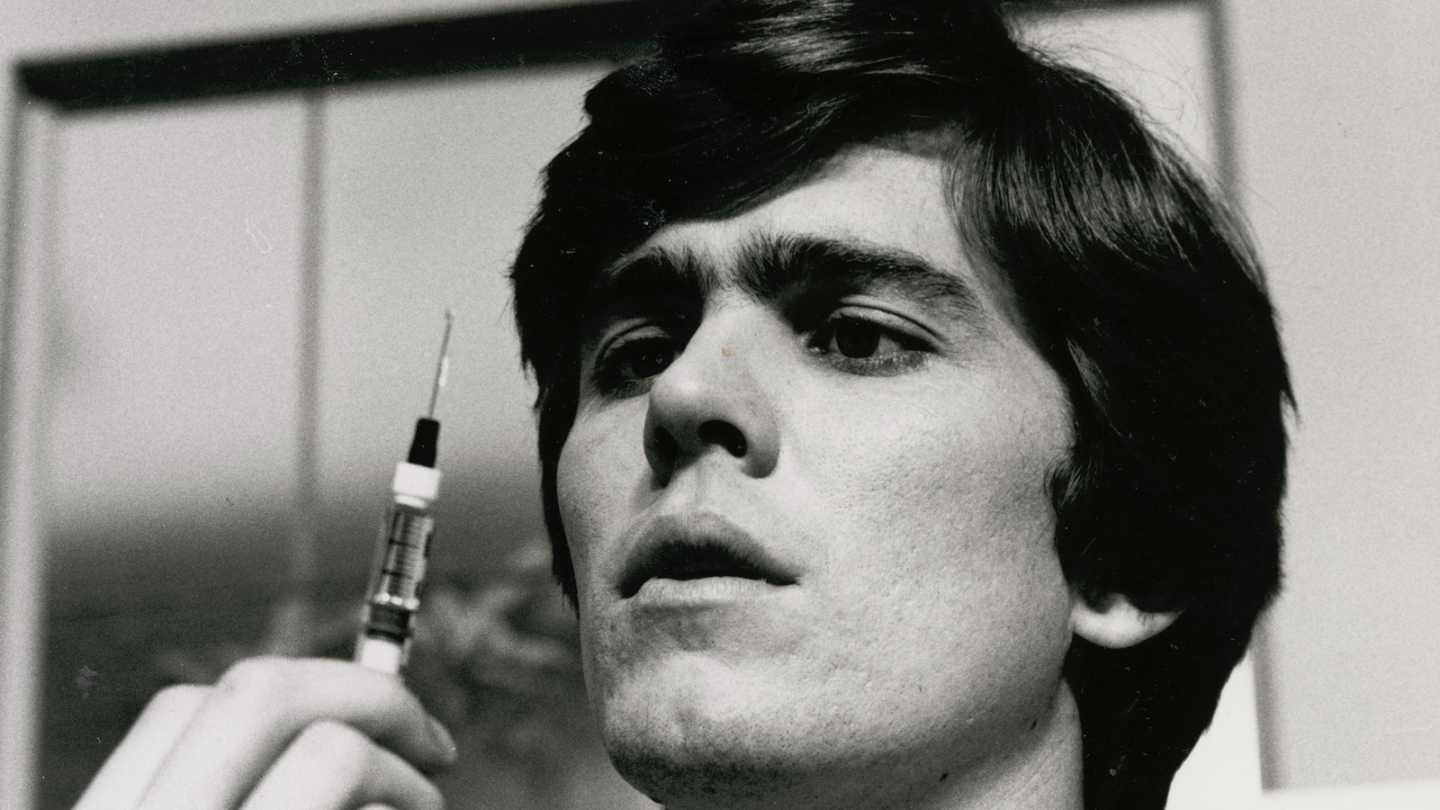 Mark Holden as Dr Greg Mason in The Young Doctors, pictured holding a syringe. 