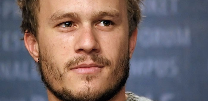 Close up of Heath Ledger looking into the distance.