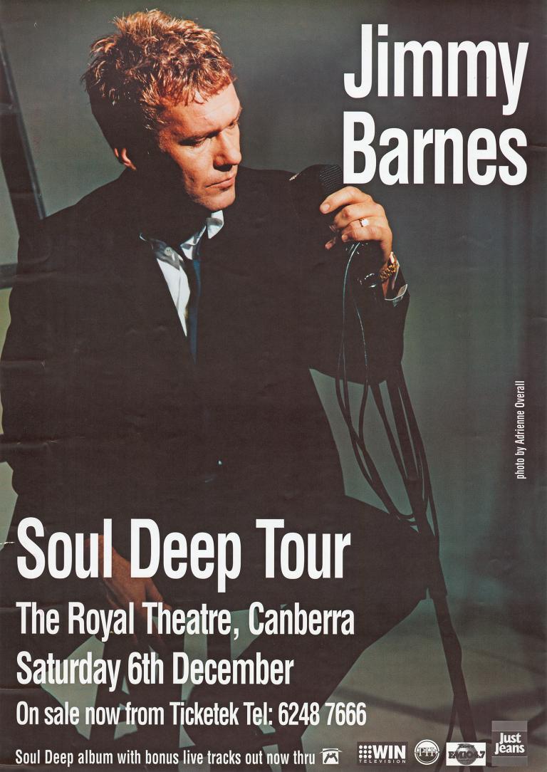 Jimmy Barnes seated in front of a microphone dressed in a black suit against a dark background. Concert tour details are superimposed over the image.