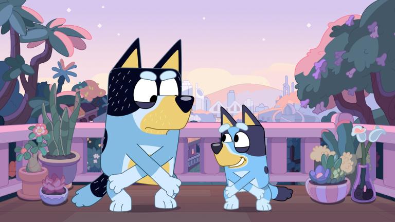 Animated still of two blue heeler dogs dancing in the twilight with the skyline of Brisbane City in the background.