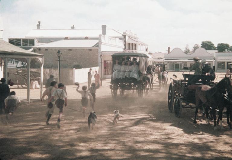 A carriage full of schoolgirls drives through Woodend in a still from Picnic at Hanging Rock.