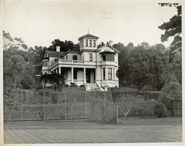 Image of a white Victorian classical style mansion.