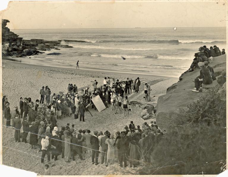 A group of men and women at Sydney's Tamarama beach filming a party scene for the film Those Who Love (1926)