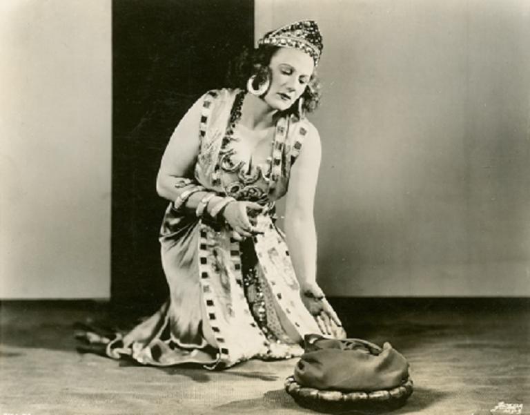Marjorie Lawrence kneeling and dressed as Salome.
