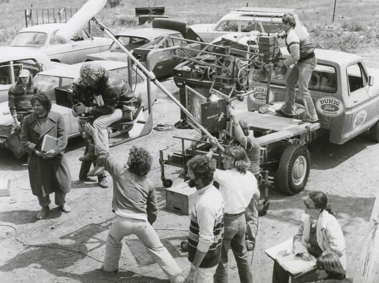 Group shot of production crew during filming of Mad Max 1.
