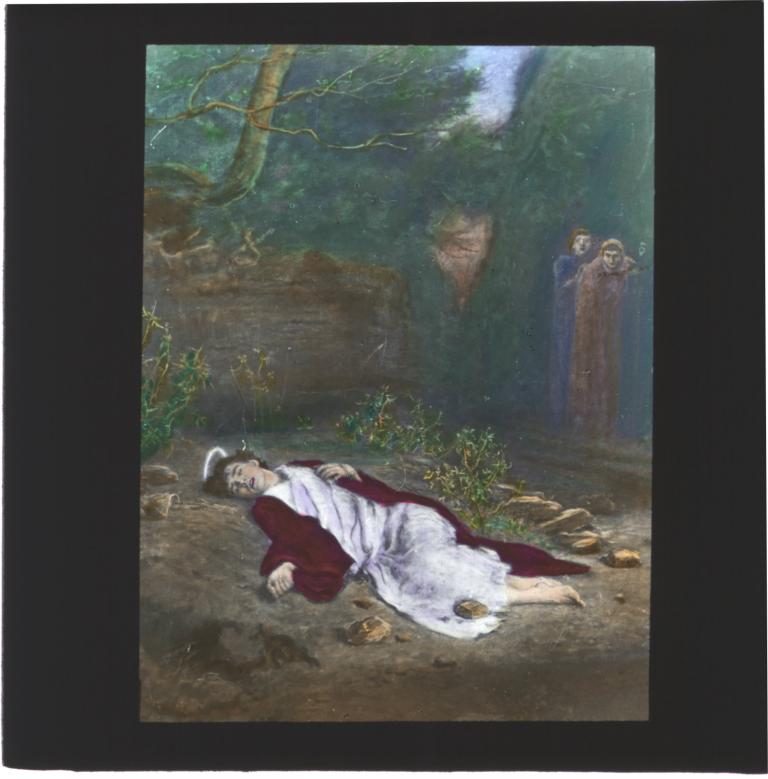 A figure laying on the ground with onlookers off to the side