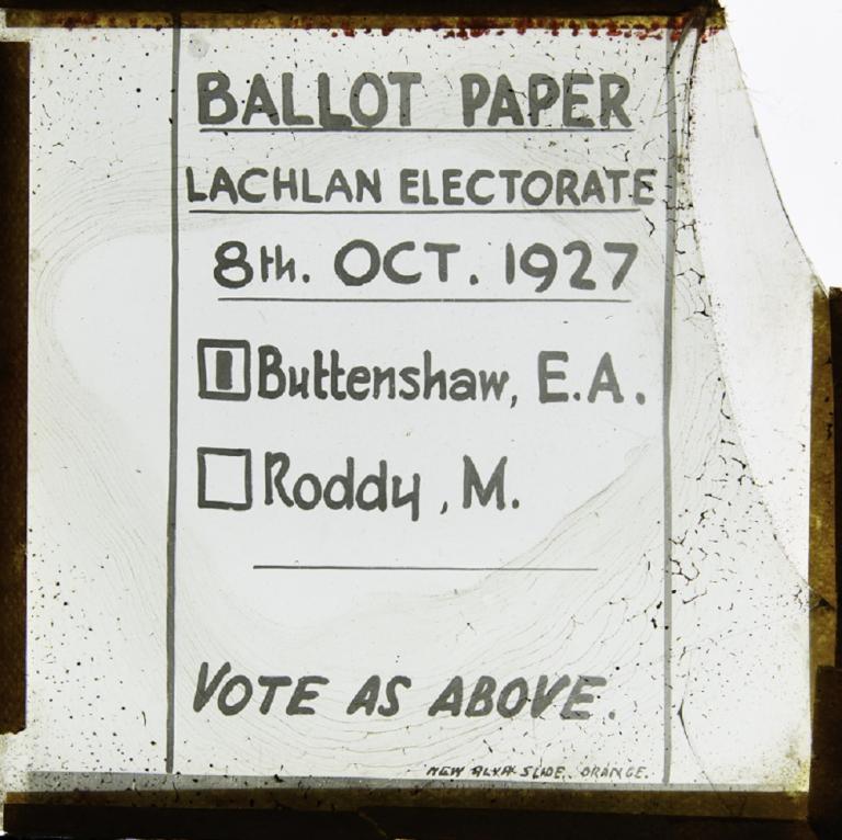 Handwritten glass slide showing ballot paper Clear background with black text. Text: 'Ballot Paper Lachlan Electorate 8th Oct. 1927'. Listed names are [1] Buttenshaw, E.A. and Roddy, M