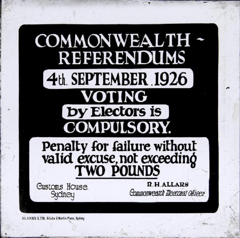 Professionally printed glass slide advertising the newly introduced compulsory voting system. 