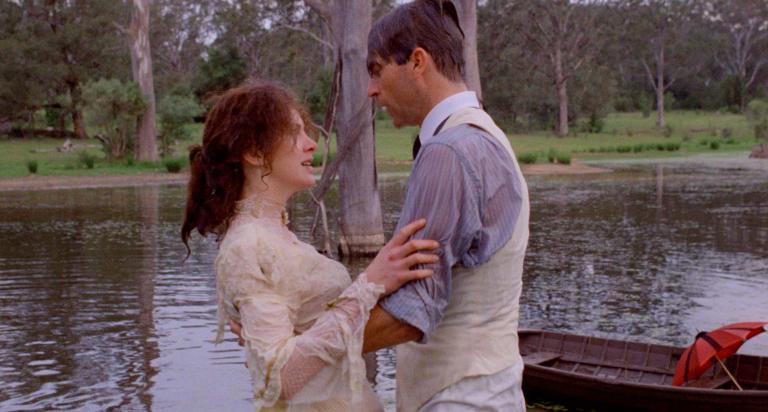 A wet Judy Davis holds on to Sam Neill after their boat capsized in My Brilliant Career