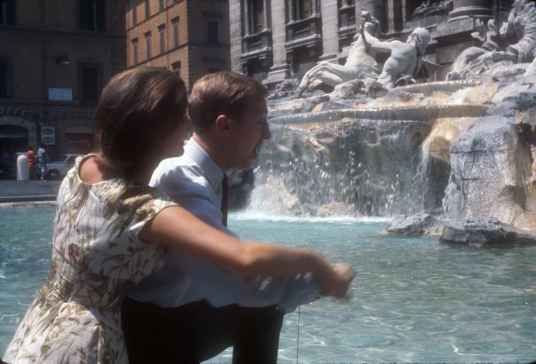 Graham Kennedy and Silvana Alliotti toss coins in the Trevi Fountain, Rome, Italy