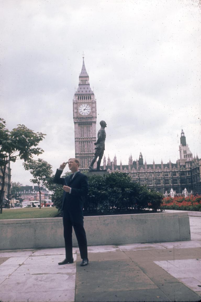 Graham Kennedy taking photos in Parliament Square, London. Big Ben, Westminster Hall and the statue of Field Marshal Jan Christiaan Smuts in the background