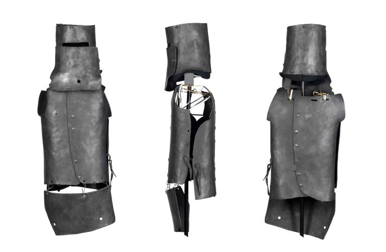 Three different views of a replica of Ned Kelly's helmet and body armour.