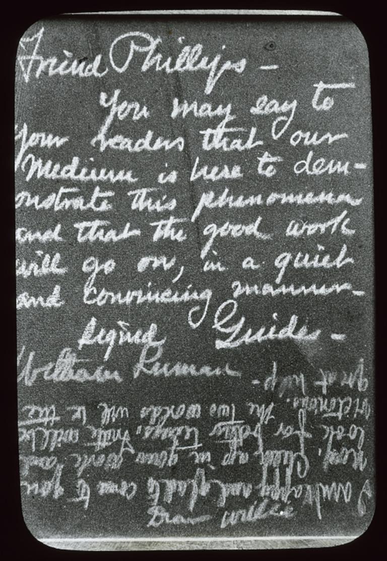Black and white glass slide showing two different styles of writing of words from spirits.