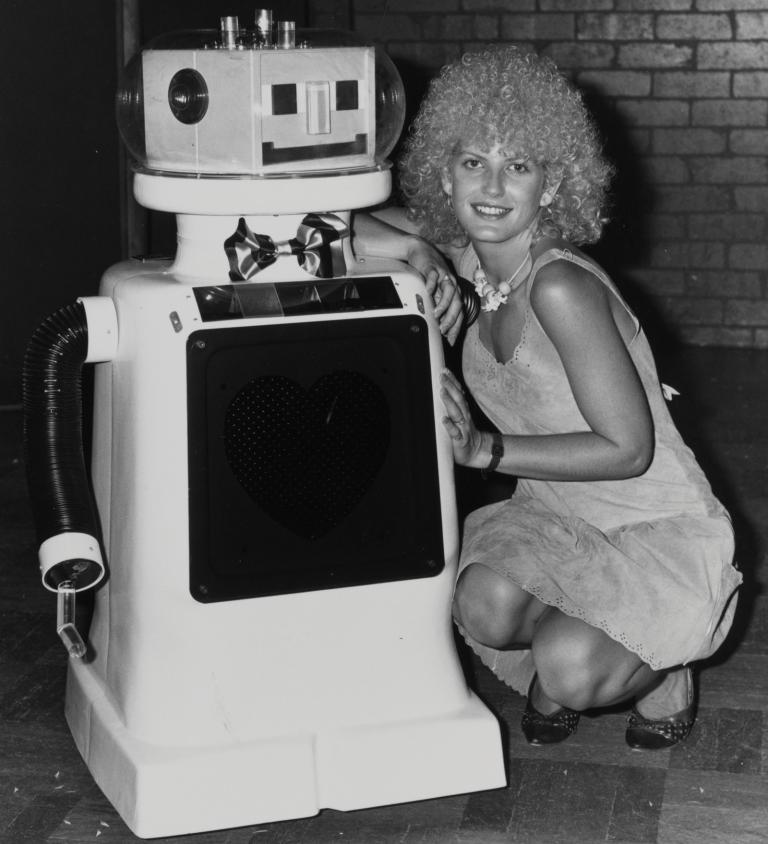Wonder World! reporter Edith Bliss poses for a photo with Dexter, the robot from the TV dating show Perfect Match.