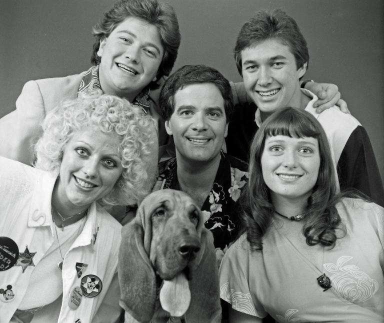 The Wonder World Team, circa 1982. Pictured clockwise from top left: Jonathan Coleman, Simon Townsend, Maurice Parker, Alita Fahey, Woodrow the Bloodhound and Sandy Mauger.