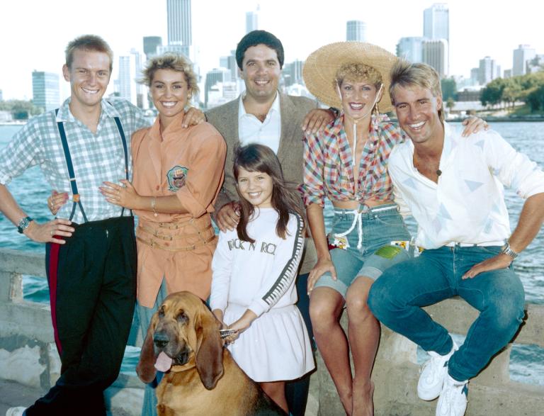 The Wonder World Team, circa 1985. Pictured left to right: Phillip Tanner, Malinda Rutter, Simon Townsend, Edith Bliss, Brett Clements, and in front is Dear Danni and Woodrow the Bloodhound.