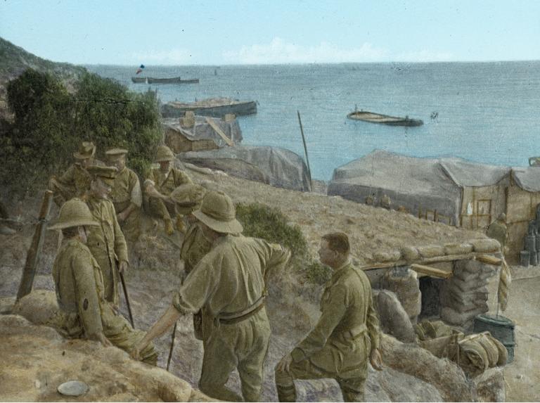 Hand-coloured glass slide shows British soldiers near a dugout at Anzac Cove.