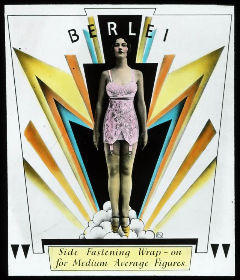 A woman wearing a pink foundation garment stands amidst art deco design elements suggesting clouds and lightening. The text reads 'side fastening wrap-on [corset] for medium average figures'.