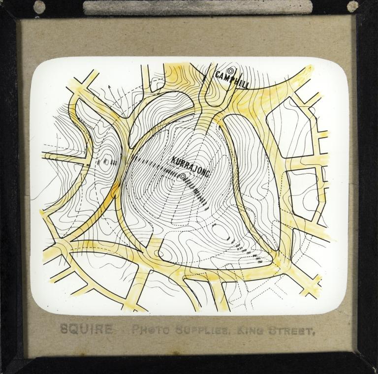 Glass slide showing an alternative design proposed by Walter Scott Griffiths for Kurrajong Hill. Griffith's plan is overlaid onto Walter Burley Griffin's plan for the Hill