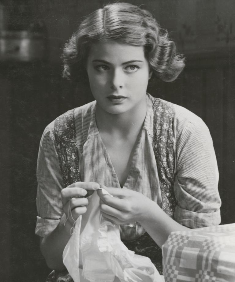 Ingrid Bergman holding some cloth in a still from the film Bränningar, 1935.