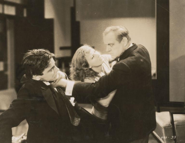 Greta Garbo intervenes in a struggle between two men in a still from the film The Kiss, 1929.