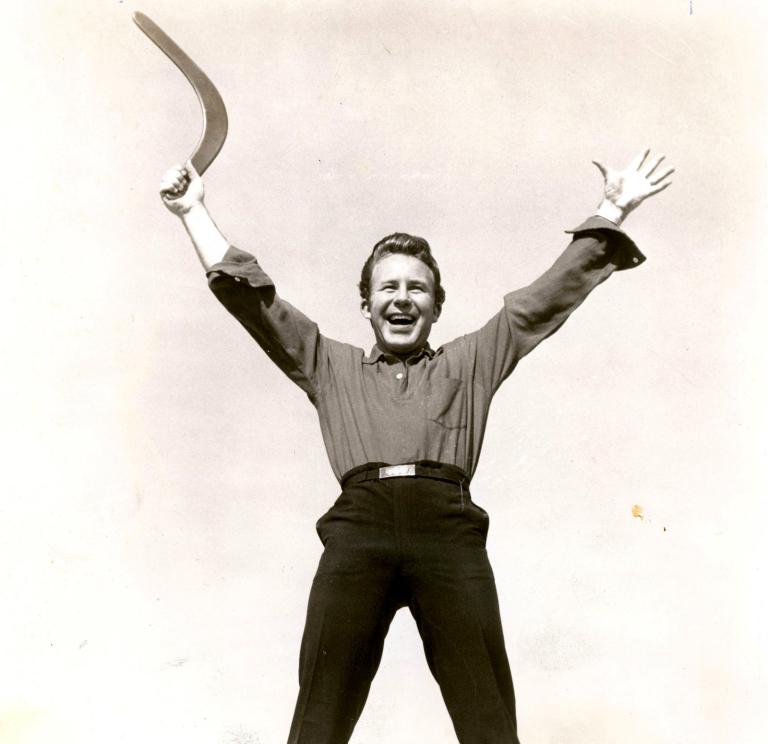 Publicity shot of Johnny O'Keefe holding a boomerang 