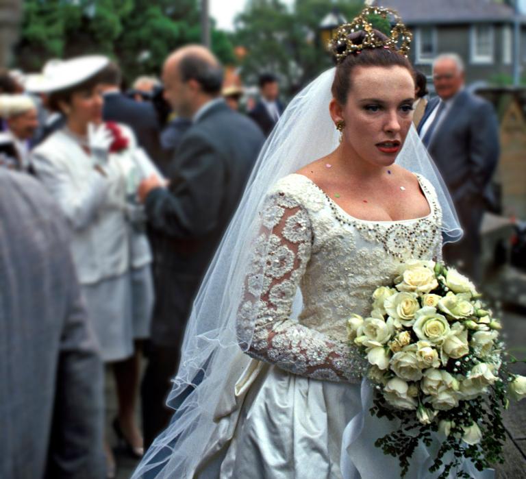 Muriel (Toni Collette) with bouquet after the wedding ceremony 