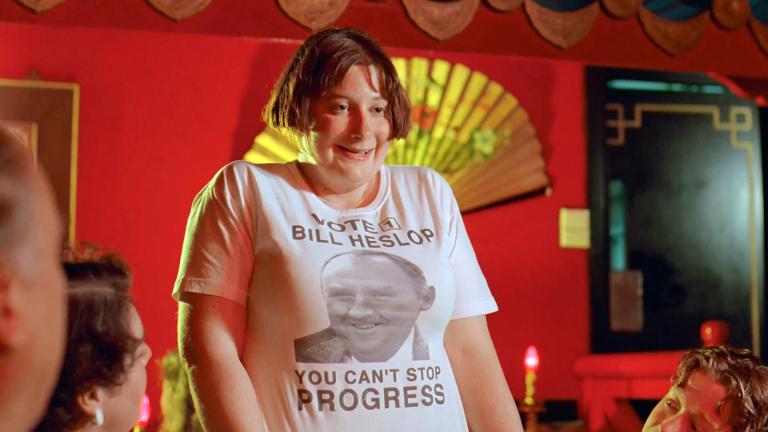 Joanie Heslop (Gabby Millgate) wearing a t-shirt featuring 'Vote 1 Bill Heslop - you can't stop progress' with Bill's face (Bill Hunter)