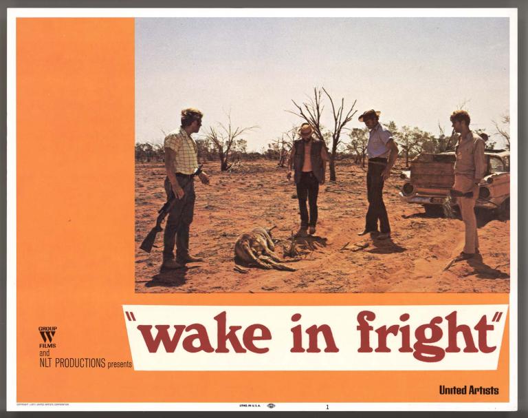 Wake in Fright film lobby card featuring a photo of Jack Thompson, Donald Pleasence, Peter Whittle and Gary Bond standing over a dead kangaroo during a hunting trip