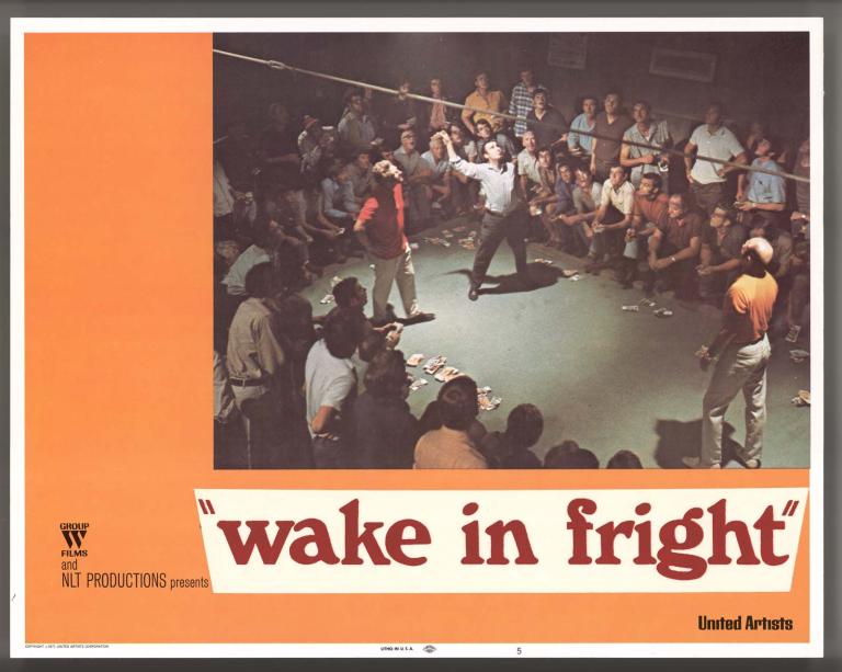 Wake in Fright film lobby card featuring a photo of a man tossing coins at a crowded two-up game