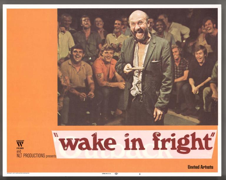 Wake in Fright film lobby card featuring a photo of Donald Pleasence at a crowded two-up game