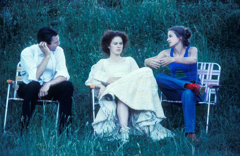 My Brilliant Career stars Sam Neill and Judy Davis sit listening to director Gillian Armstrong as they sit on fold-up chairs on location at Michelago.