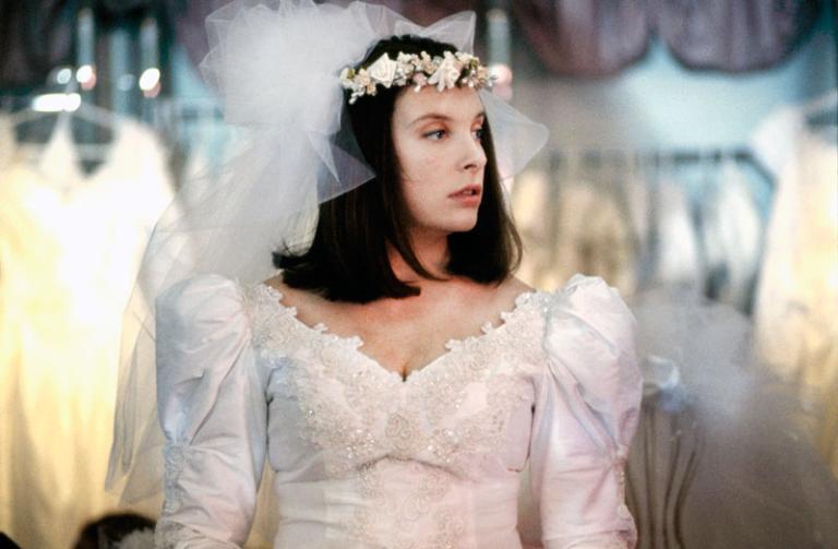 Toni Collette as Muriel trying on a wedding dress.