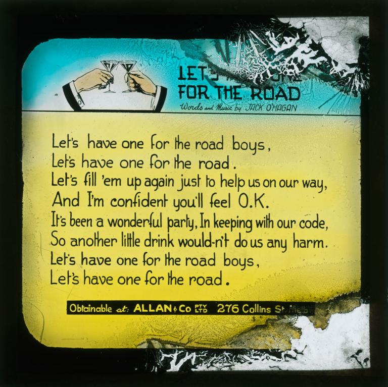 A glass slide with the words for 'Let's Have One for the Road' by Jack O'Hagan.