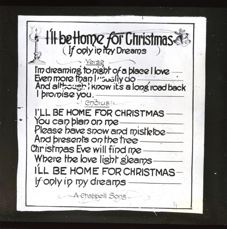Glass slide with the lyrics for I'll be Home for Christmas