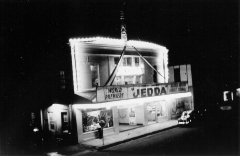 The exterior of the Star Theatre in Darwin at night, advertising the world premiere of Jedda in January 1955