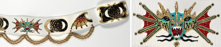 A decorative belt featuring chains and rhinestones and an image of a head of a Chinese dragon.