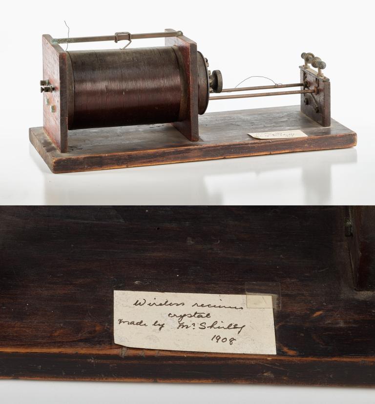 Wireless radio receiver, c1908. Featured a wooden board with a cylinder attached and a copper wire wound tightly around the cylinder.