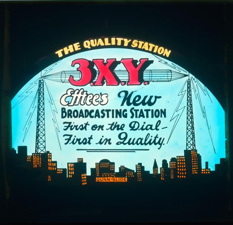 glass cinema side featuring an advertisement for radio station 3XY