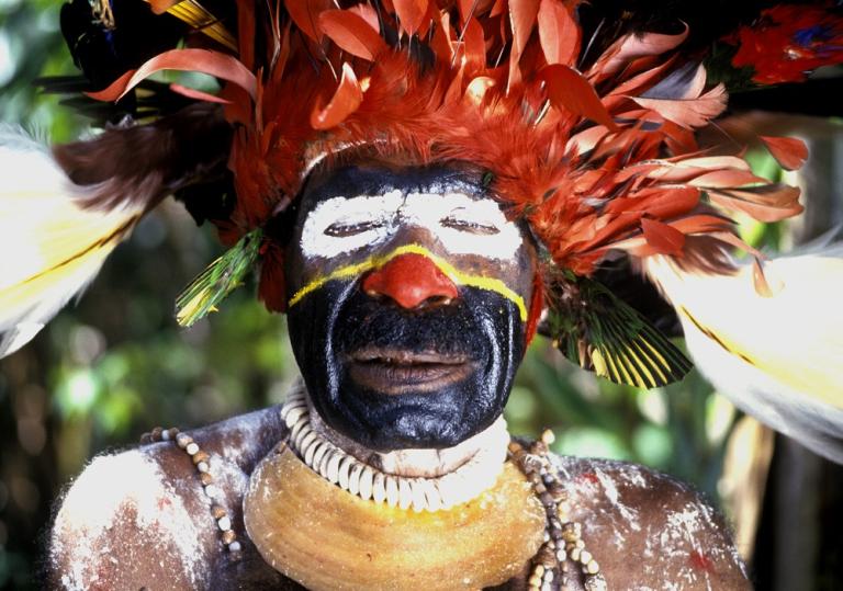 Image of a Papua new Guinea man wearing tribal costume.
