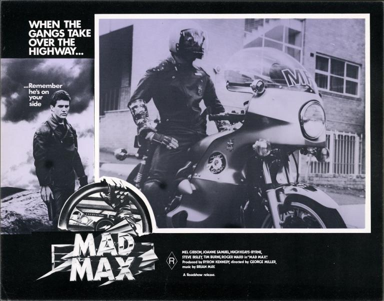 Lobby card for Mad Max shows Goose (Steve Bisley) astride his motorbike.