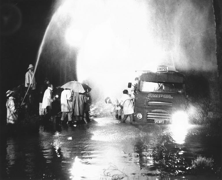 Skippy crew filming while making rain with a firehose.