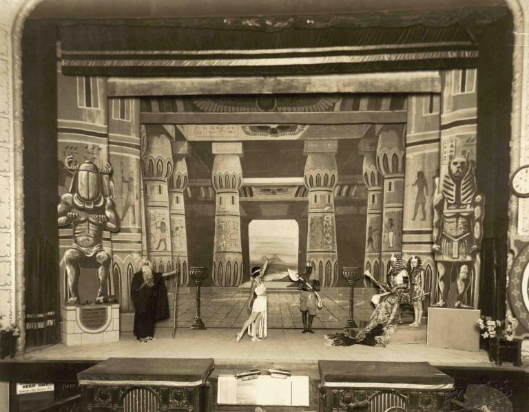 Five actors in period dress perform a prologue on stage before a screening of The Ten Commandments in Far North Queensland in 1925
