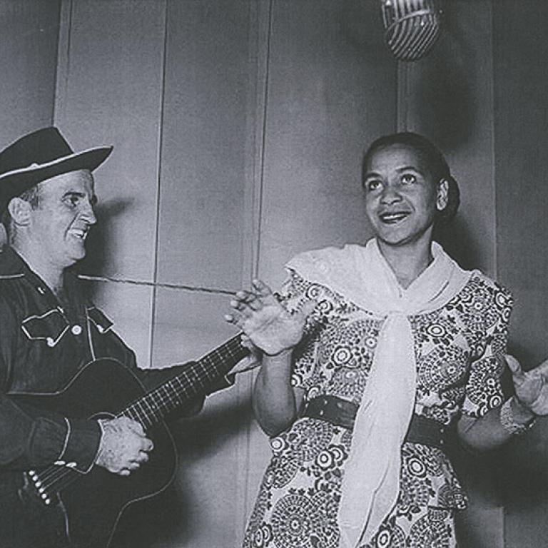 Black and white image of 50s jazz and blues singer Georgia Lee pictured with unknown guitarist