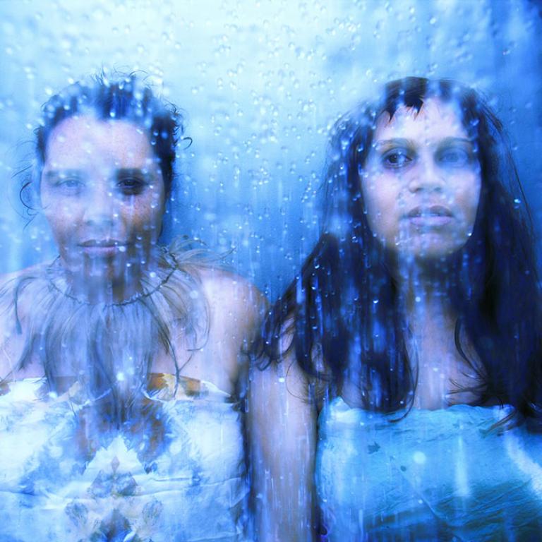 Two women (Nardi Simpson and Kaleena Briggs) standing next to each other, water effect on top.