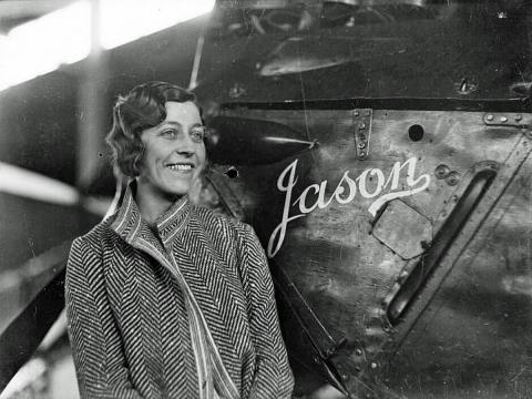Amy Johnson standing next to her de Havilland Moth aeroplane 'Jason'.